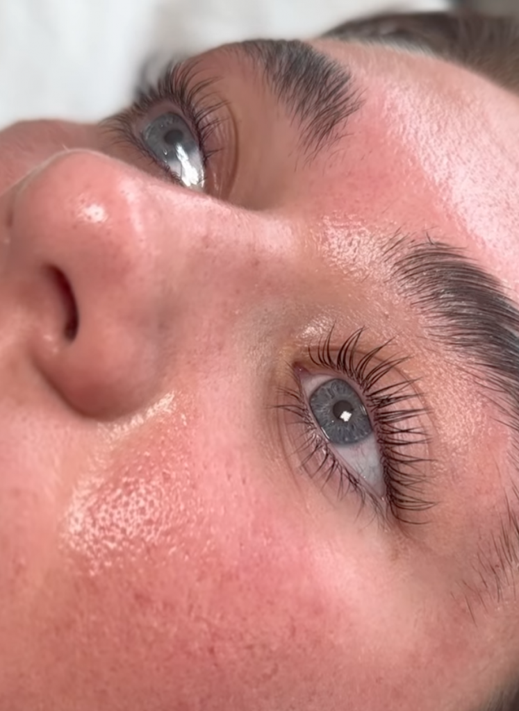 Girl with eyes open after a LVL Lash Treatment showing long and fluffy eyelashes