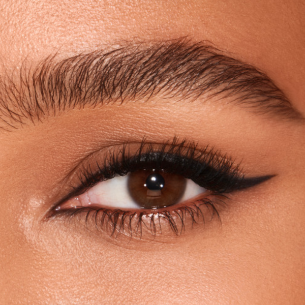 Close up of model's eye wearing Charlotte Tilbury Classic Black Eyeliner with a cat eye flick style